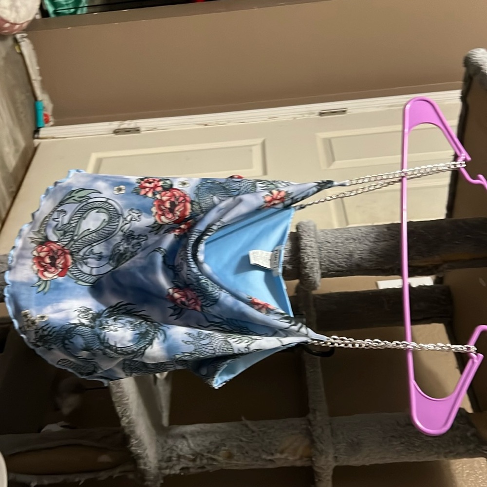 Light blue with pink dragon design